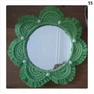 Decorative mirror with macrame frame and floral design