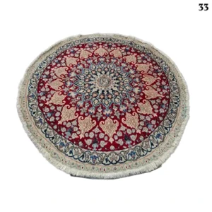 A pair of handmade Nain round rugs, 1.5 meters in diameter