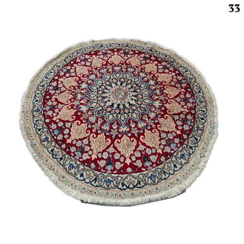 A pair of handmade Nain round rugs, 1.5 meters in diameter